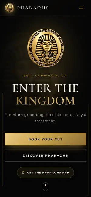 PHARAOHS barbershop website on a phone